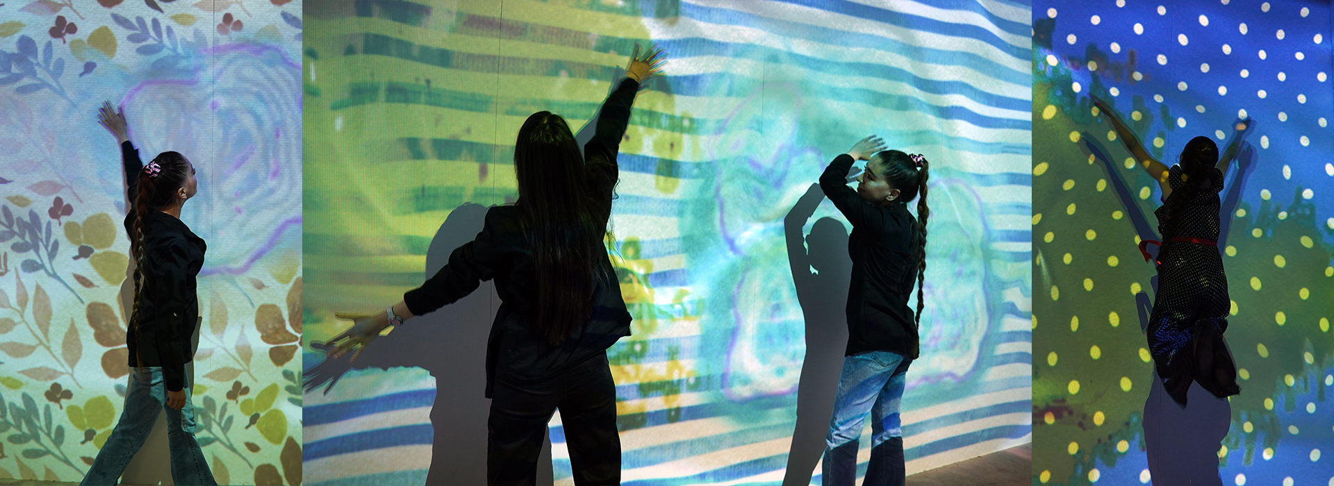 Multiple individuals using hand movements on an interactively generated projection wall with different patterns appearing on the walls.